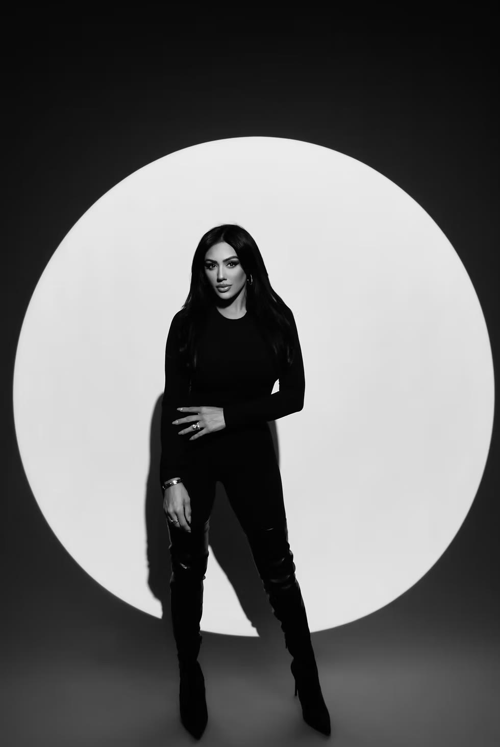 Anjali Wrenn, celebrity makeup artist, in a dramatic spotlight portrait